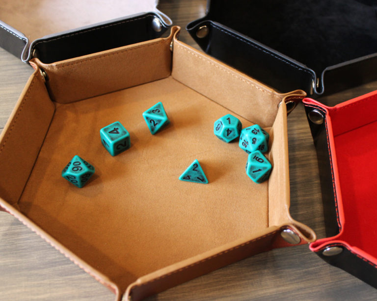 Brown dice tray with green dice