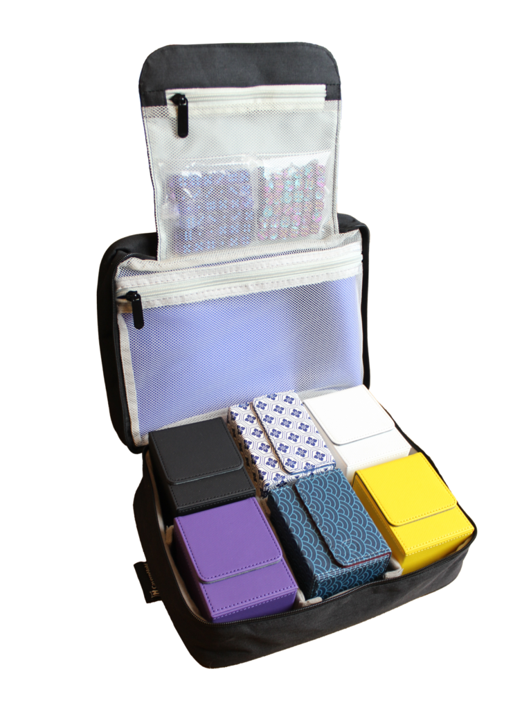 Open bag with 6 deck boxes, a playmat, and two sets of d6 dice counters.